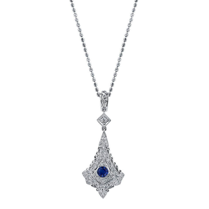 a necklace with a blue stone in the center