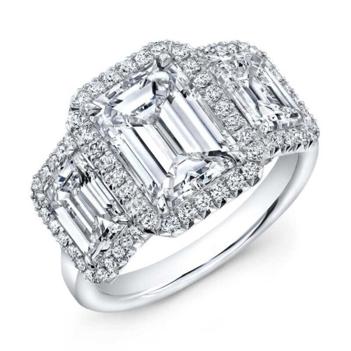 an emerald cut diamond ring with three baguetts
