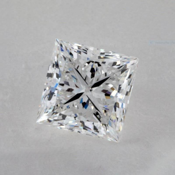 a square cut diamond on a white surface