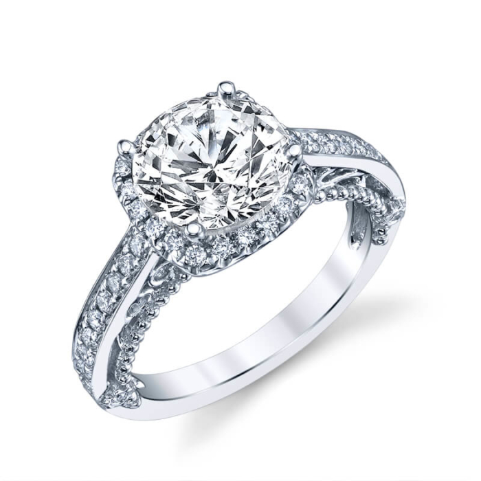 a white gold engagement ring with a diamond center