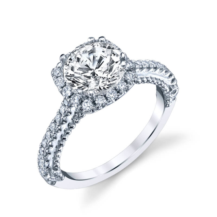 a white gold engagement ring with diamonds on the band