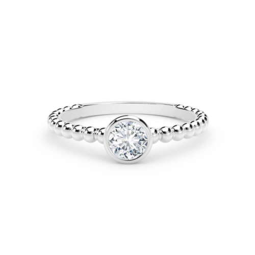 a white gold ring with beaded details and a single diamond