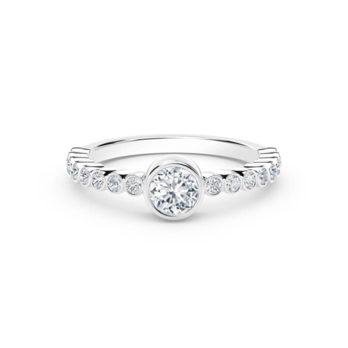 a white gold ring with diamonds on the side