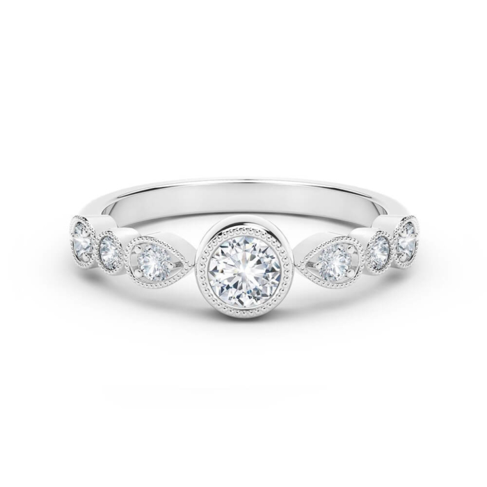 a white gold engagement ring with three diamonds