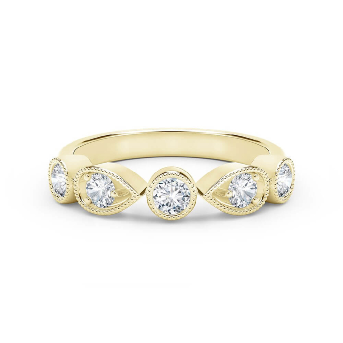 a yellow gold ring with three diamonds