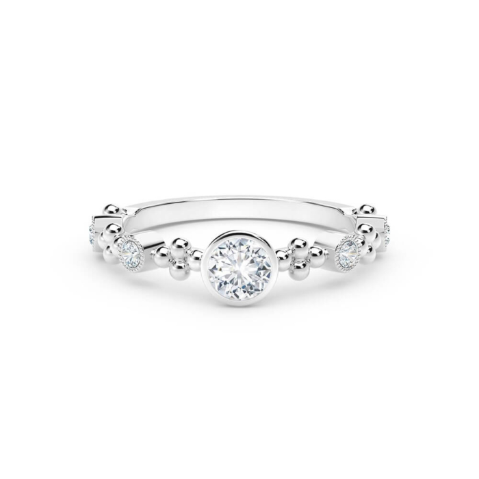 a white gold ring with three diamonds on it