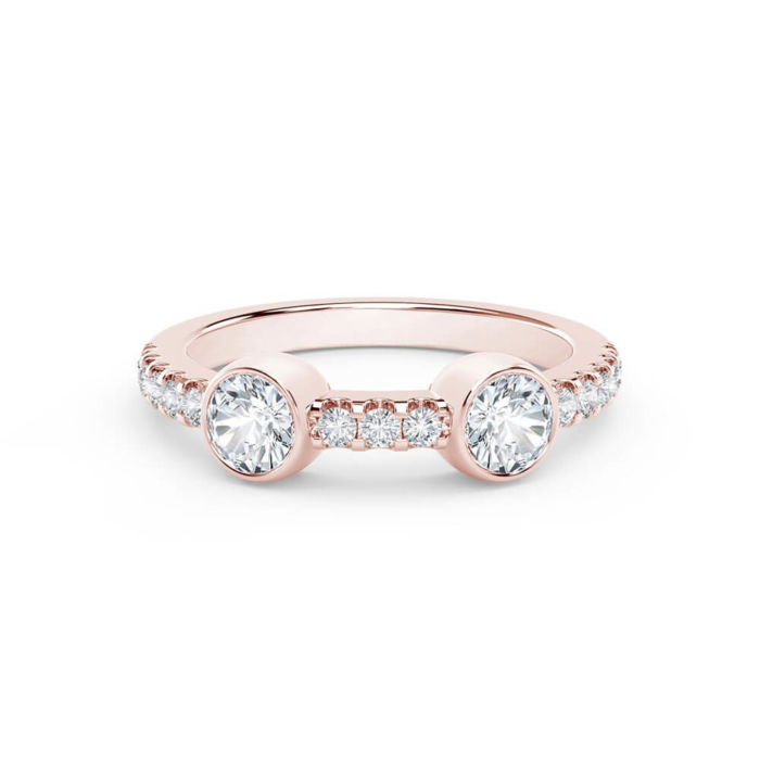 a rose gold ring with three round diamonds