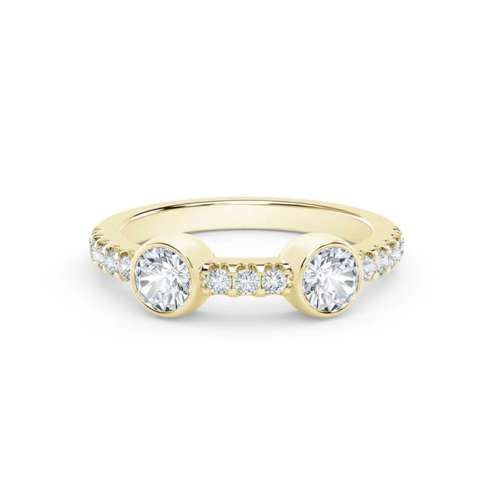 a yellow gold ring with three round diamonds