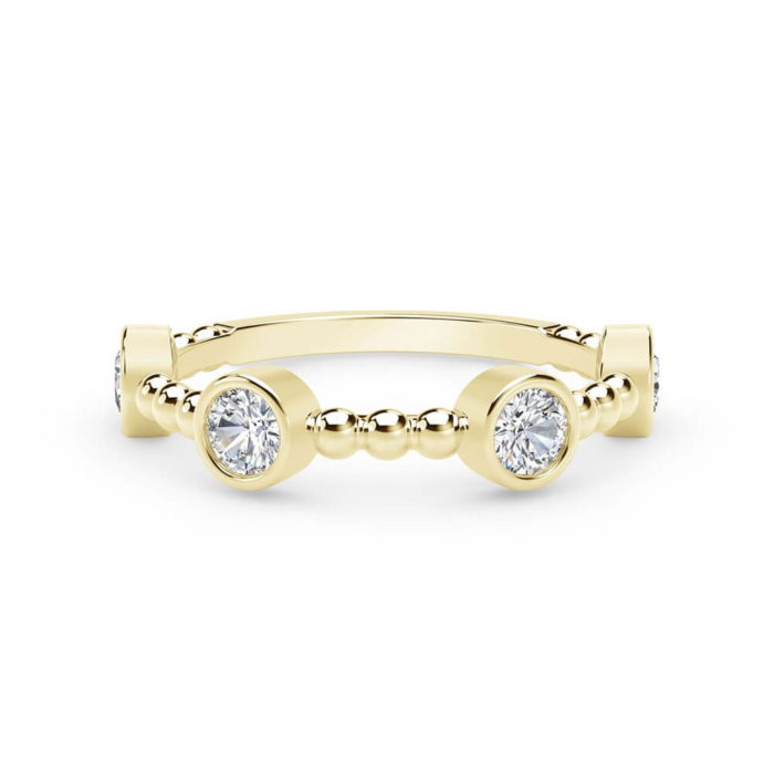 a yellow gold ring with two round diamonds