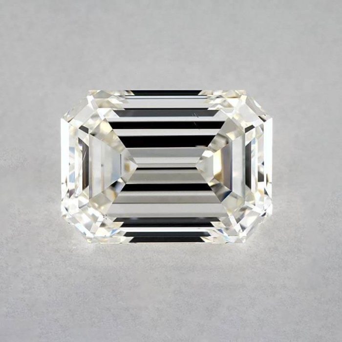 an emerald cut diamond on a white surface
