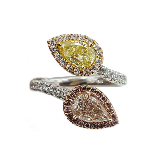 two yellow and white diamond rings on top of each other