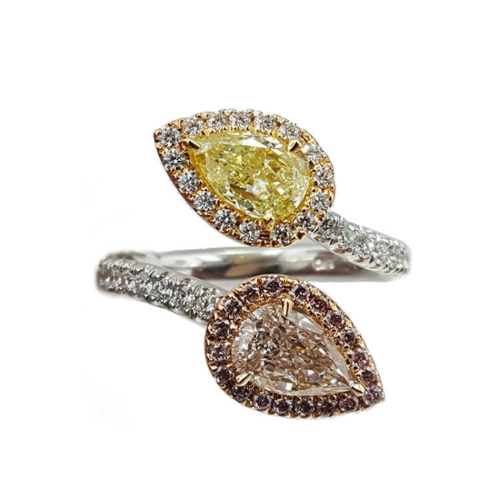 two yellow and white diamond rings on top of each other