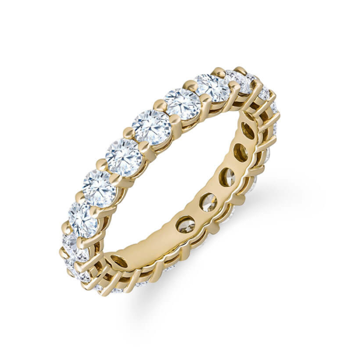 a yellow gold ring with five round diamonds