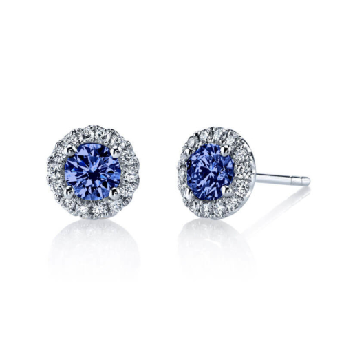 a pair of blue and white diamond earrings