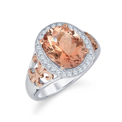 a ring with an orange stone and diamond accents