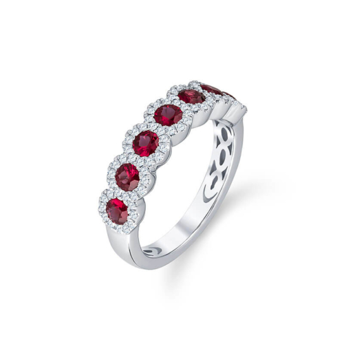 a white gold ring with three red stones