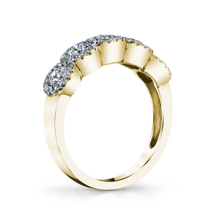 a yellow gold ring with three diamonds on top