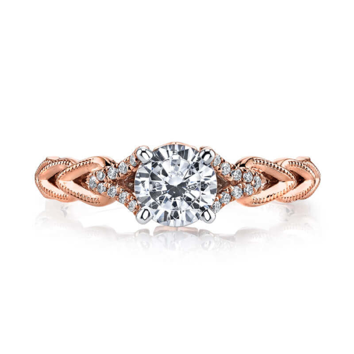 a rose gold engagement ring with a diamond center
