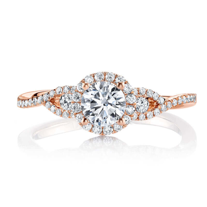 a rose gold engagement ring with two diamonds