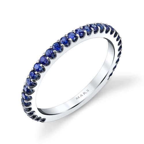 a white gold ring with blue sapphire stones