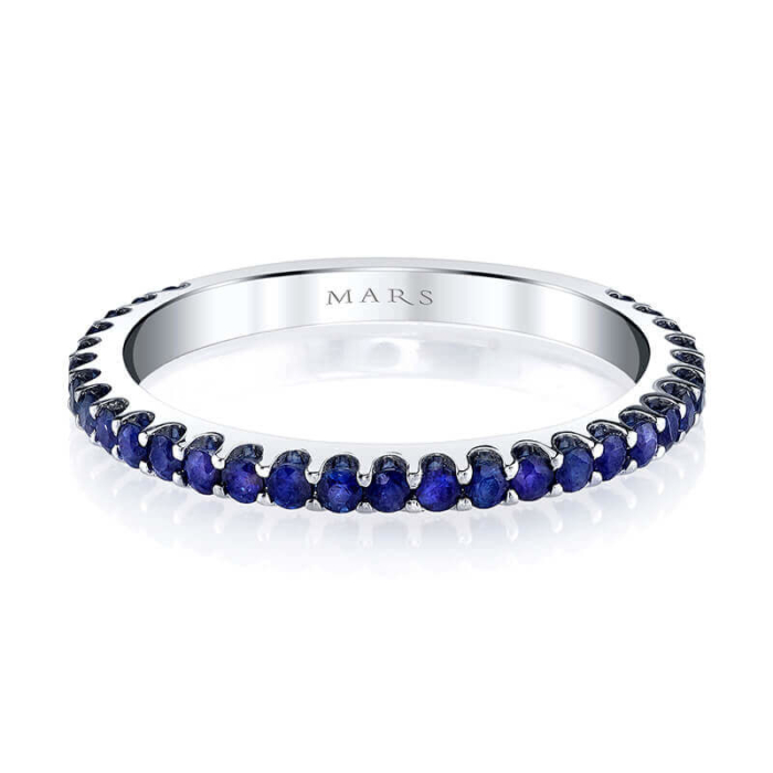 a white gold ring with blue sapphire stones
