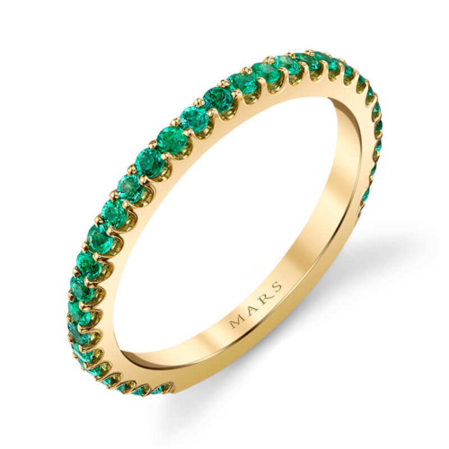 a yellow gold ring with emerald stones