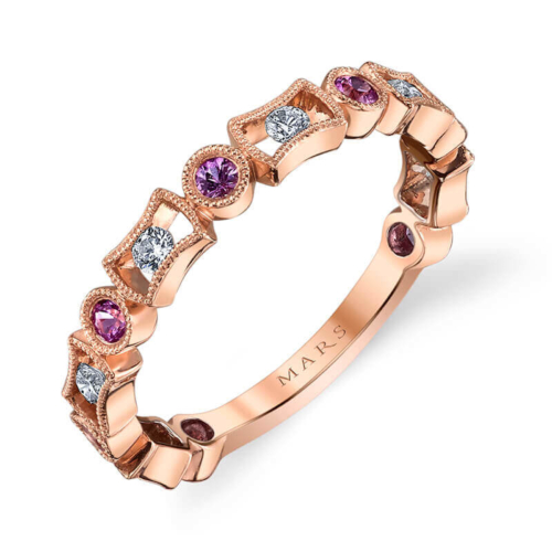a rose gold ring with three different colored stones