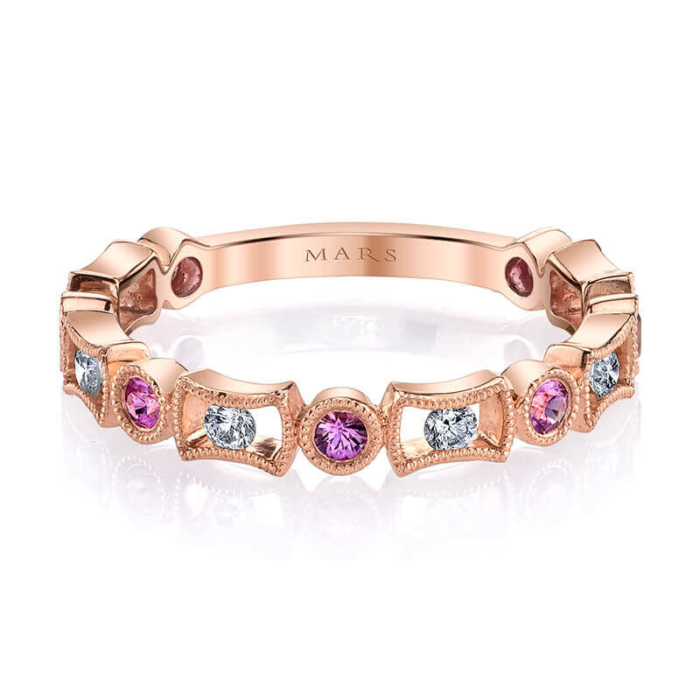 a pink and white diamond ring with three stones