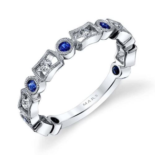 a white gold ring with blue sapphires and diamonds