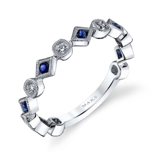 a white gold ring with blue sapphires and diamonds