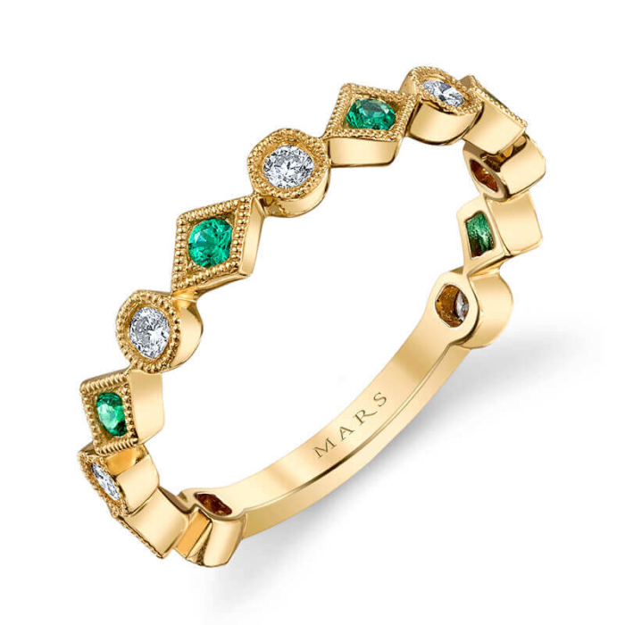 a yellow gold ring with emerald and diamonds