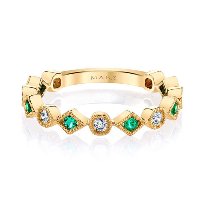 a yellow gold band with green and white stones