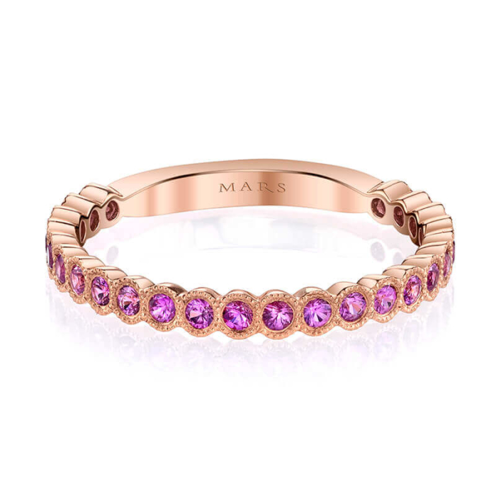 a rose gold band with pink sapphire stones