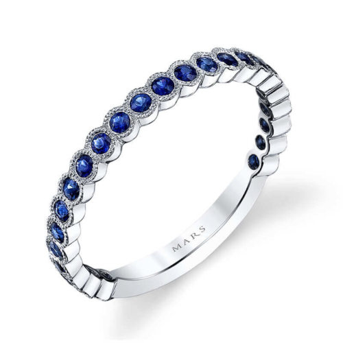 a white gold ring with blue sapphire stones