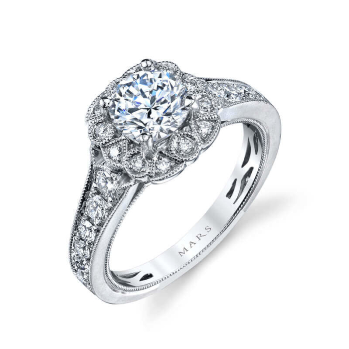 a diamond engagement ring with an intricate halo setting