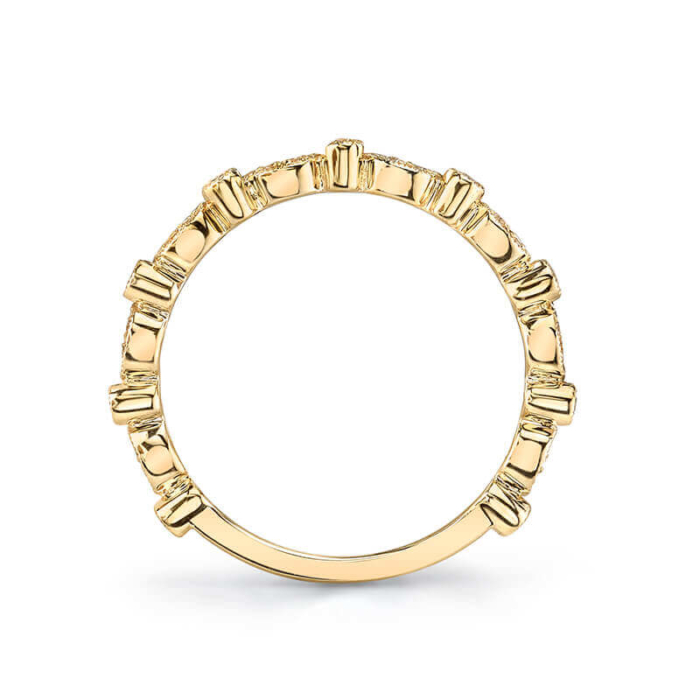a yellow gold ring with small diamonds