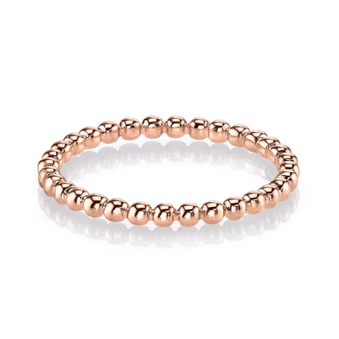 a rose gold beaded ring on a white background