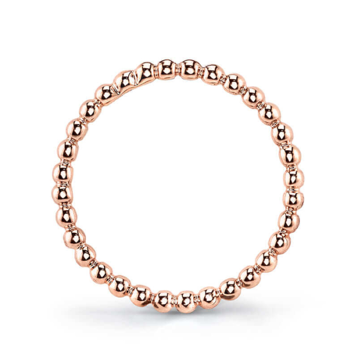 a rose gold beaded ring on a white background