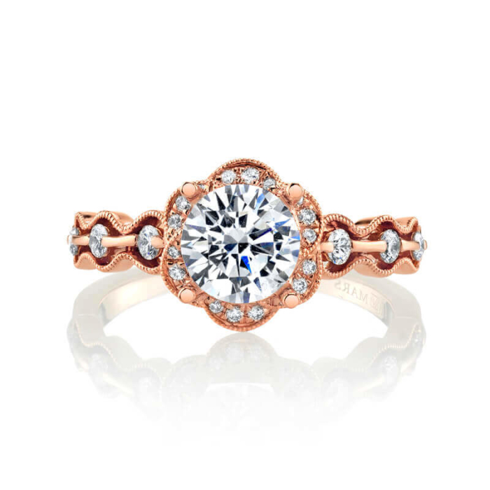 a rose gold engagement ring with a round diamond center