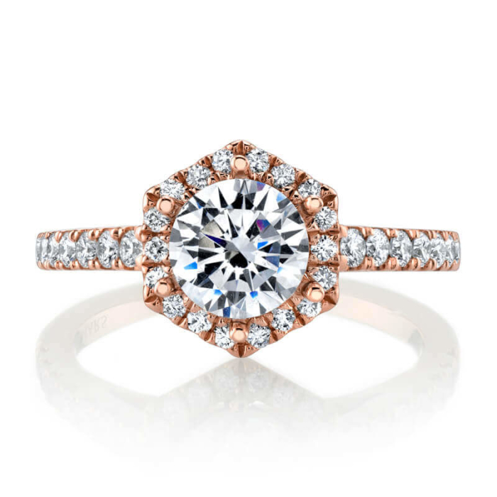 a rose gold engagement ring with a round cut diamond