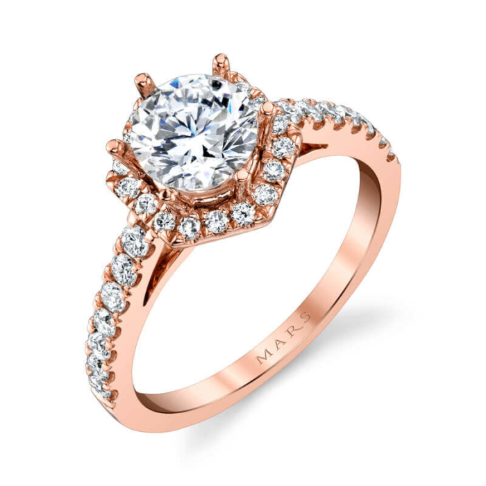 a rose gold engagement ring with an oval diamond center