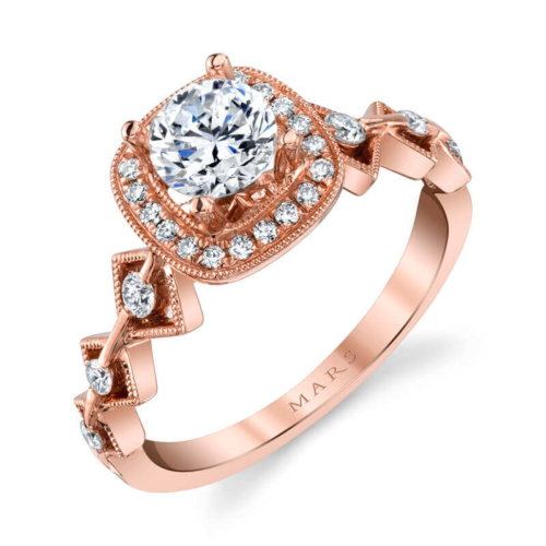 a rose gold engagement ring with an oval center surrounded by small diamonds