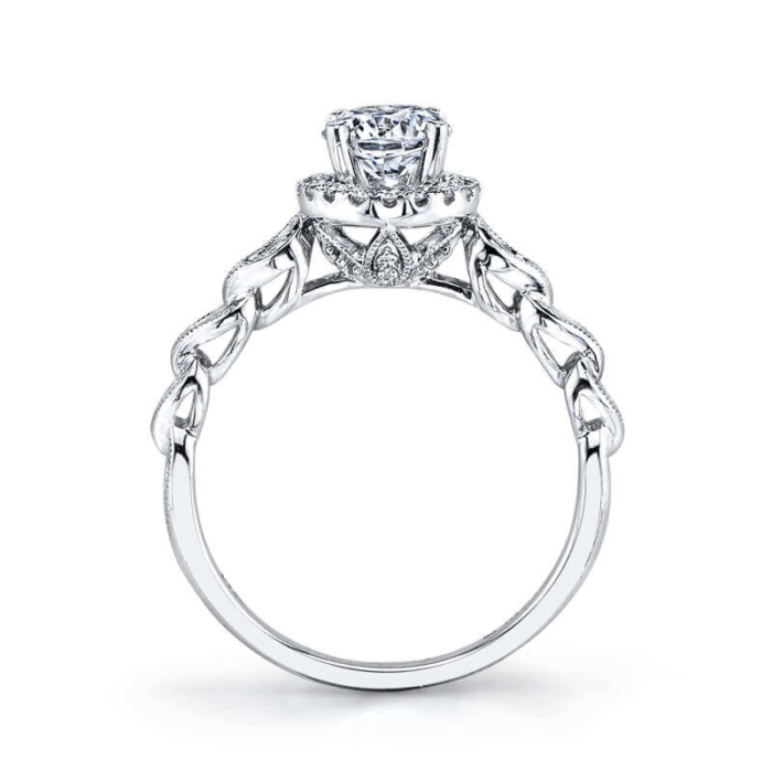 a diamond engagement ring with an intricate design