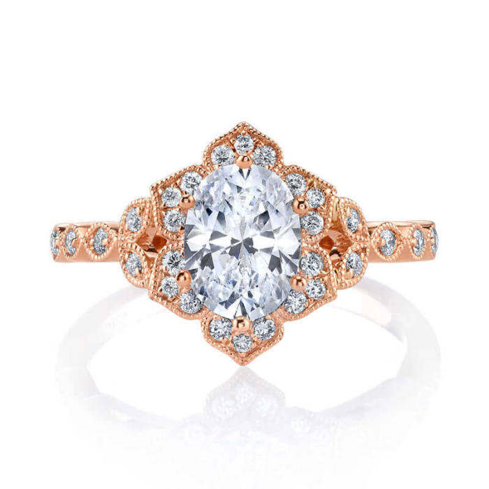 an engagement ring with a center diamond surrounded by small diamonds