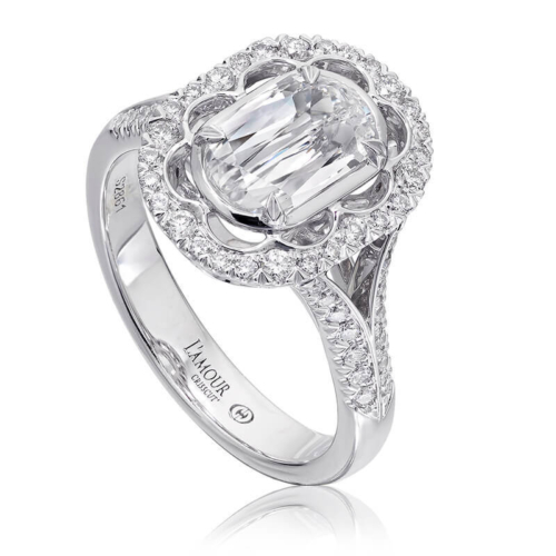 an oval cut diamond ring with halos around it