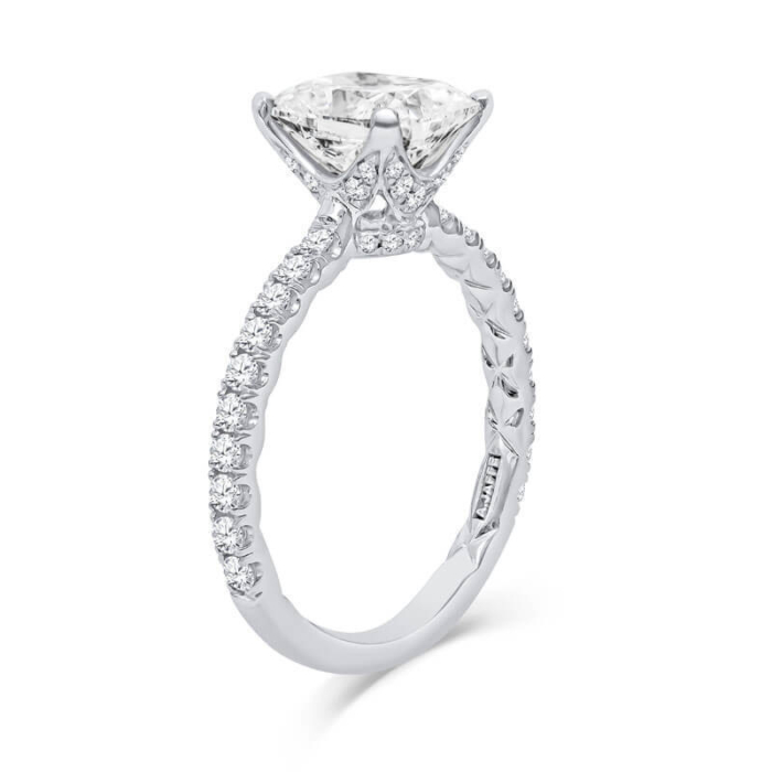 a white gold engagement ring with a princess cut diamond