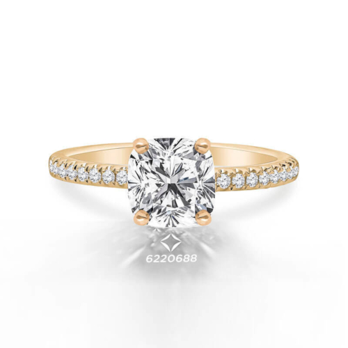 a yellow gold engagement ring with a round cut diamond
