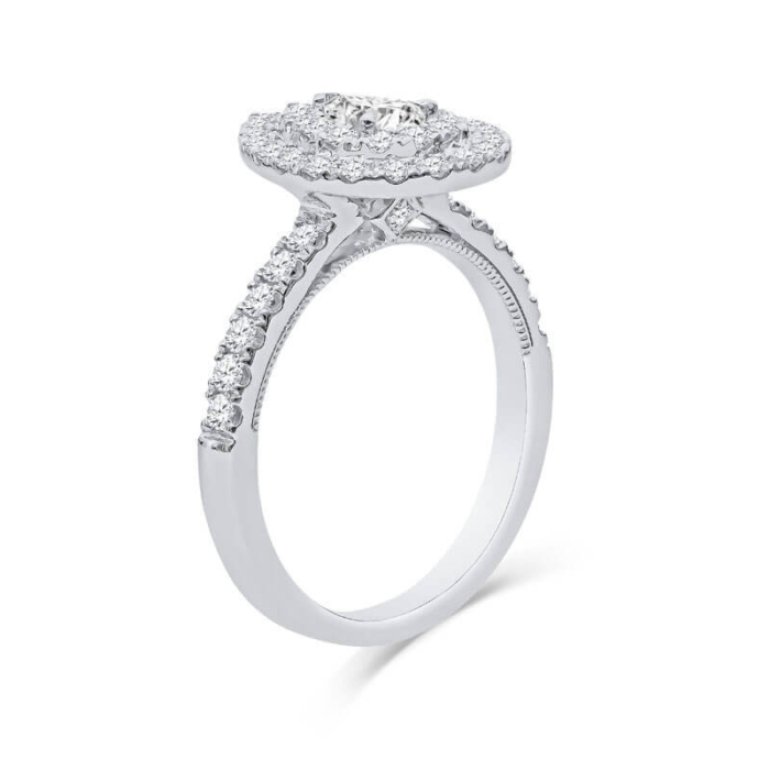 a white gold engagement ring with an oval halo setting