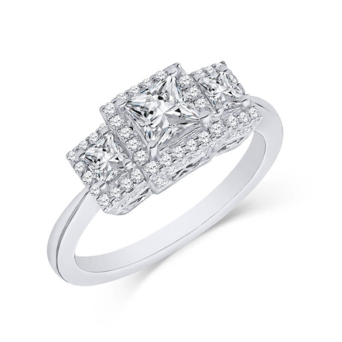 a three stone diamond ring on a white background