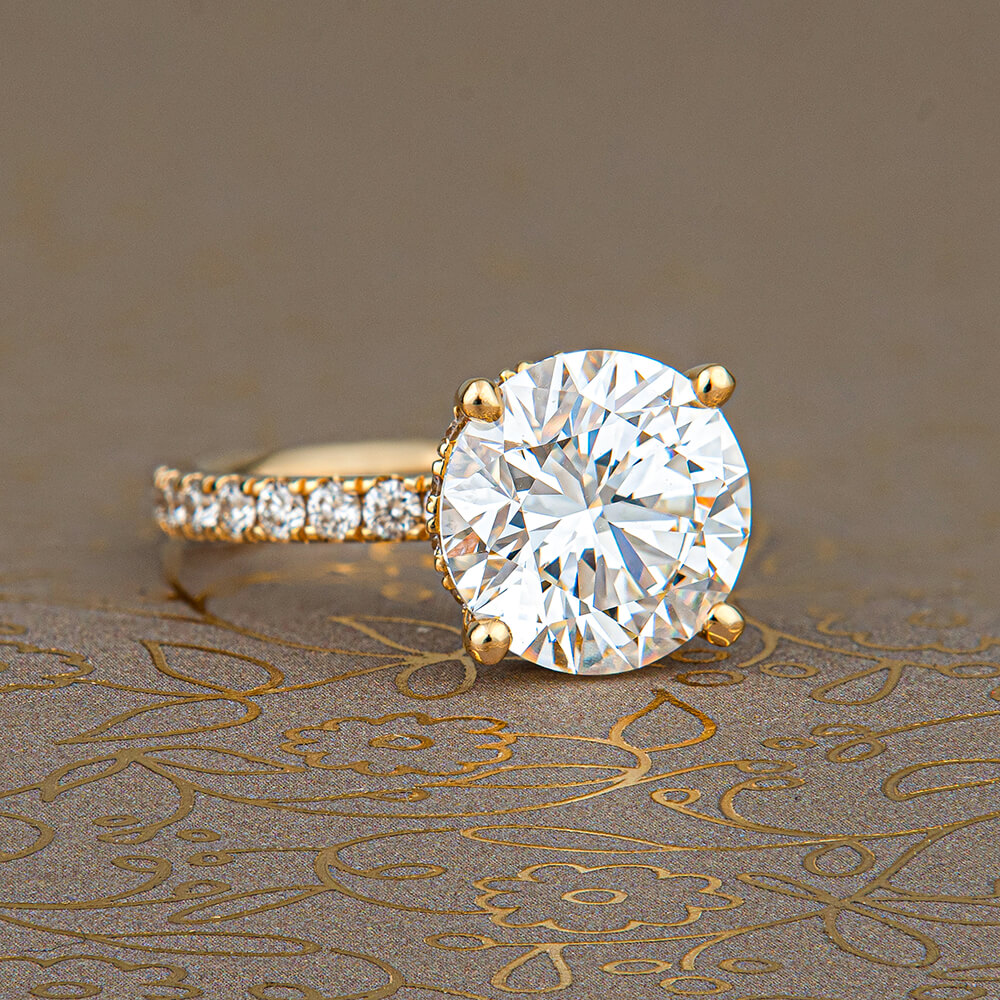 a close up of a diamond ring on a table